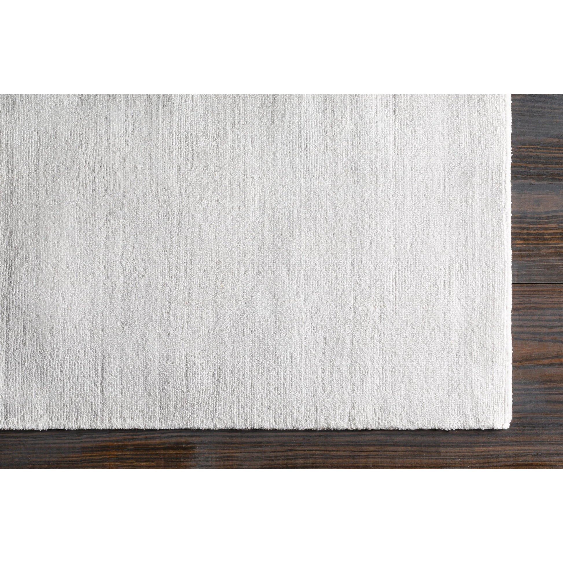 Wilkinson Rug by Livabliss in white. Made from face: 100% polyester, warp: 100% cotton in a coastal style.
