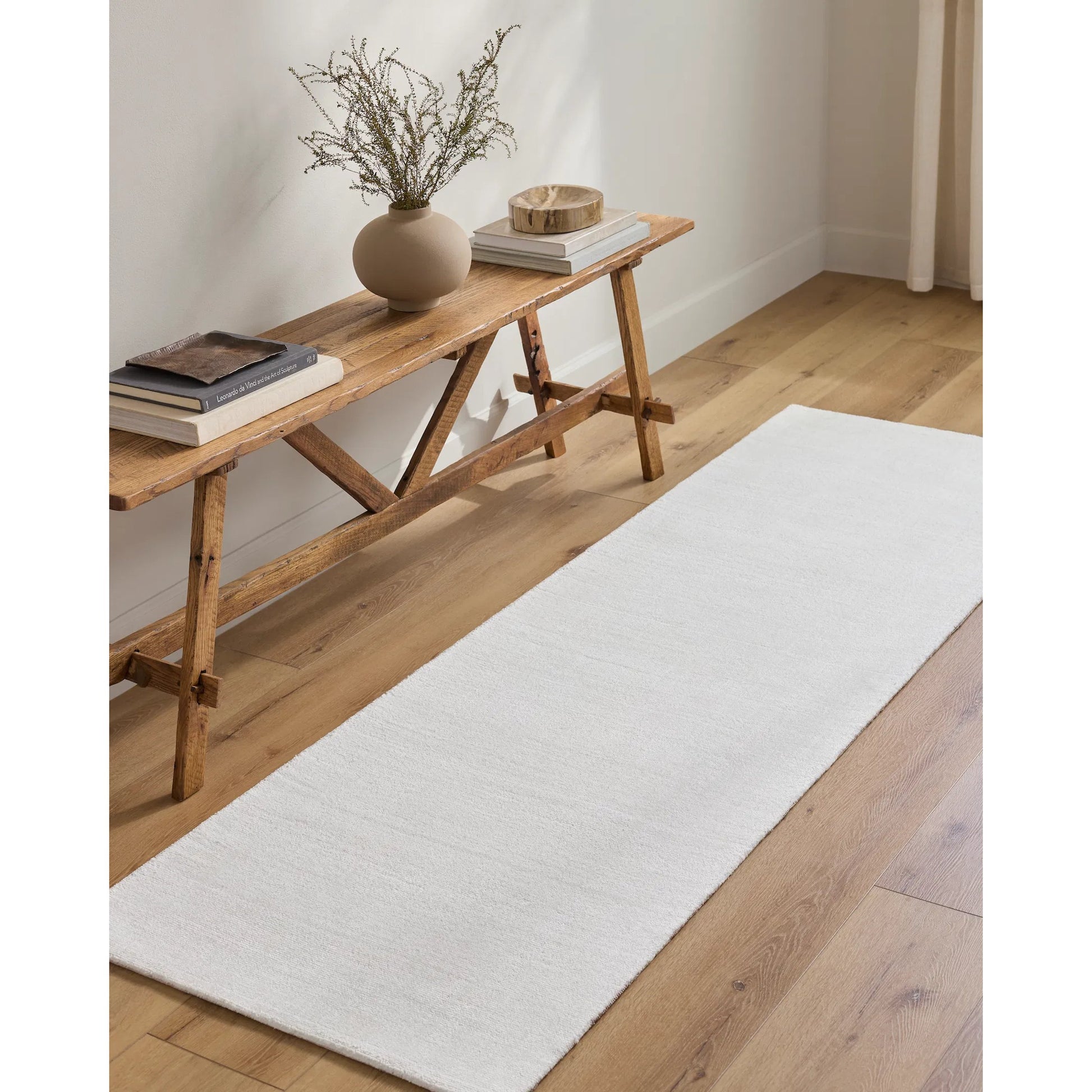 Wilkinson Rug by Livabliss in white. Made from face: 100% polyester, warp: 100% cotton in a coastal style.