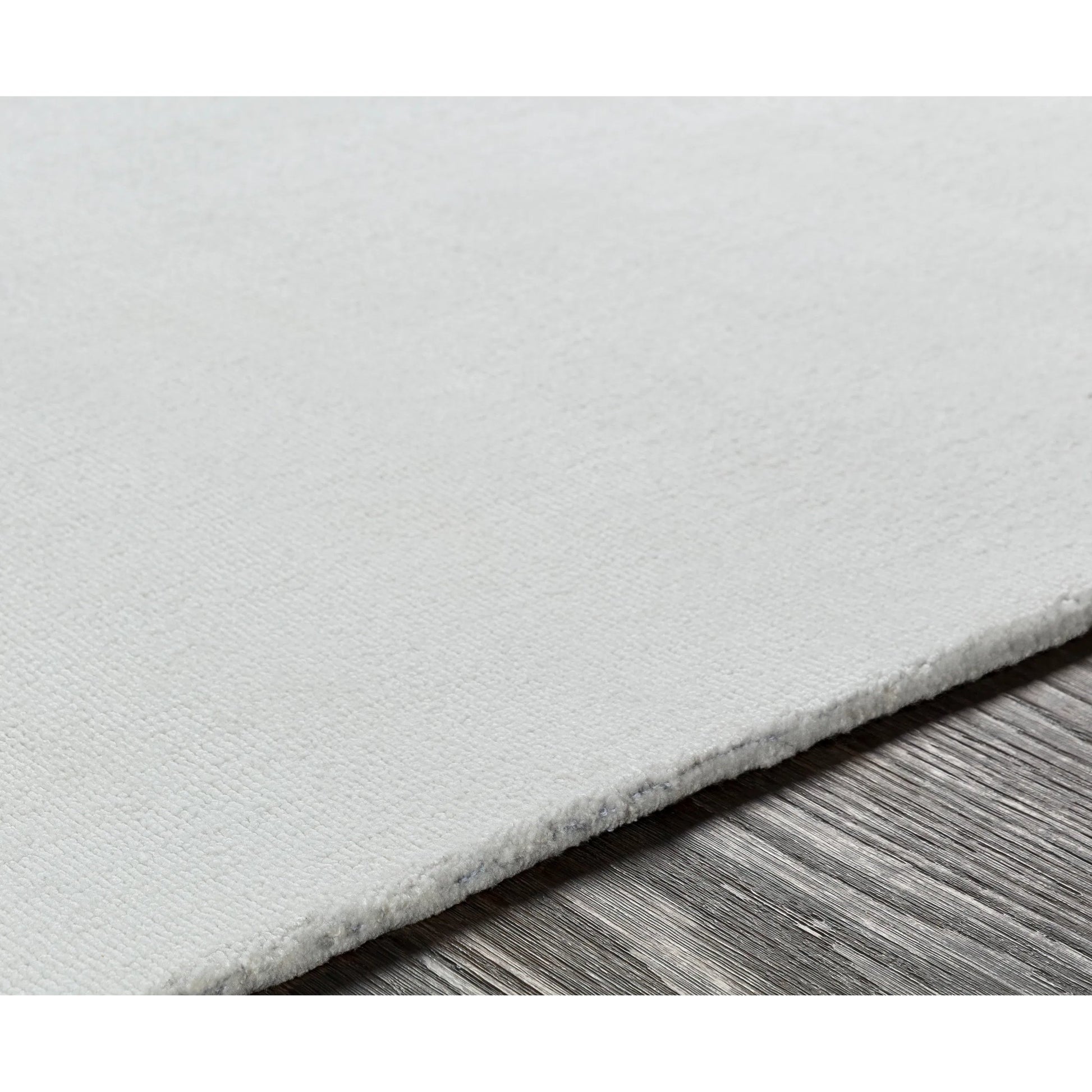Wilkinson Rug by Livabliss in white. Made from face: 100% polyester, warp: 100% cotton in a coastal style.