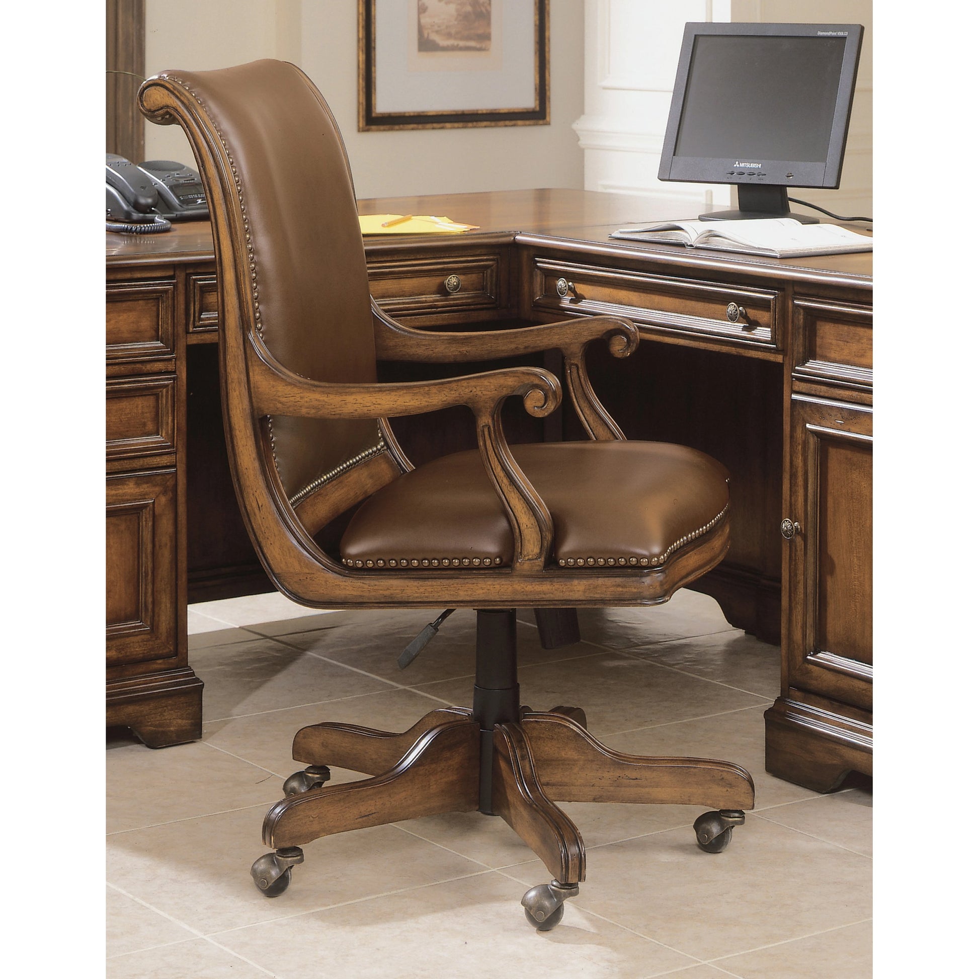 Brookhaven Desk Chair by Hooker Furniture in brown and cherry. Made from cherry veneers with split grain leather in a transitional style.