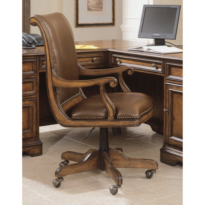 Brookhaven Desk Chair by Hooker Furniture in brown and cherry. Made from cherry veneers with split grain leather in a transitional style.