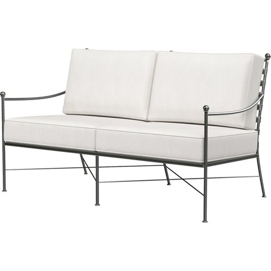 Provence Outdoor Loveseat by Sunset West. Made from wrought iron in a modern style.
