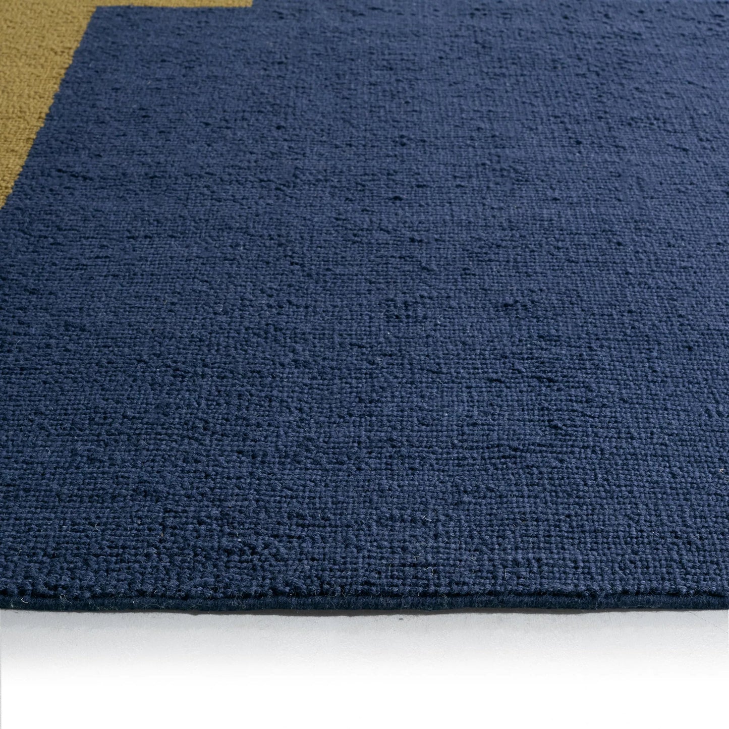 004 SI-2531451,SI-2531452,SI-2531453,SI-2531454,SI-2531455 | Closeup | Woven Construct​ WVC02 Rug by Jaipur Living in blue, yellow, gold. Made from 65% wool 35% cotton in a unique style.