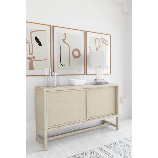 Cotiere Sideboard by A.R.T. Furniture in beige and linen. Made from parawood solids, mixed split cathedral quarter-white oak veneer, fabric, terrazzo stone in a modern style.