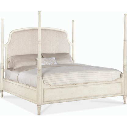 Americana King Upholstered Poster Bed by Hooker Furniture in beige. Made from oak veneers and fabric in a modern style.