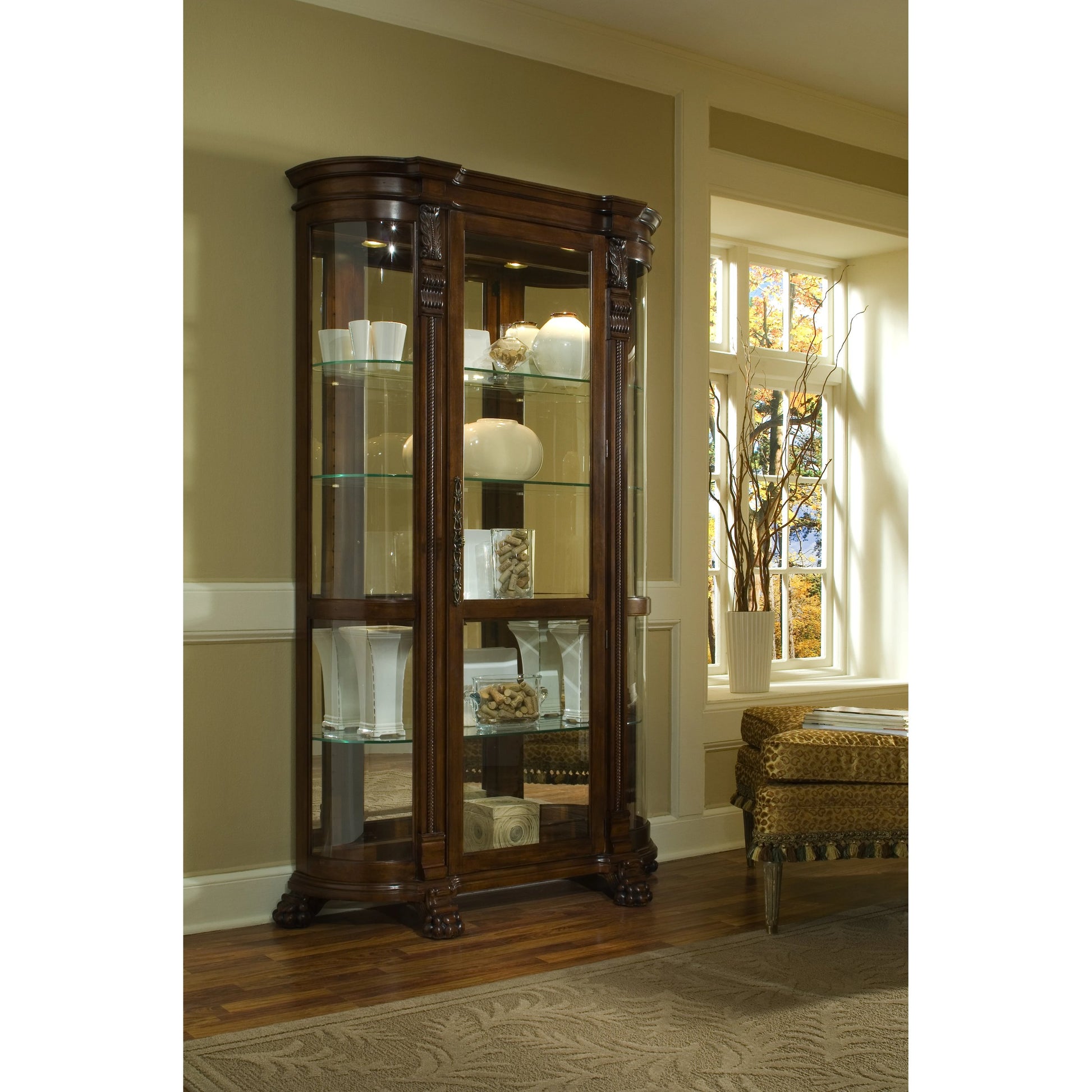Curved End Curio by Pulaski Furniture in warm maple brown. Made from select hardwood solids, veneers in a traditional style.