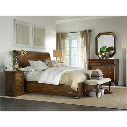 Archivist Sleigh Bed by Hooker Furniture in dark wood. Made from pecky pecan veneers in a traditional style.