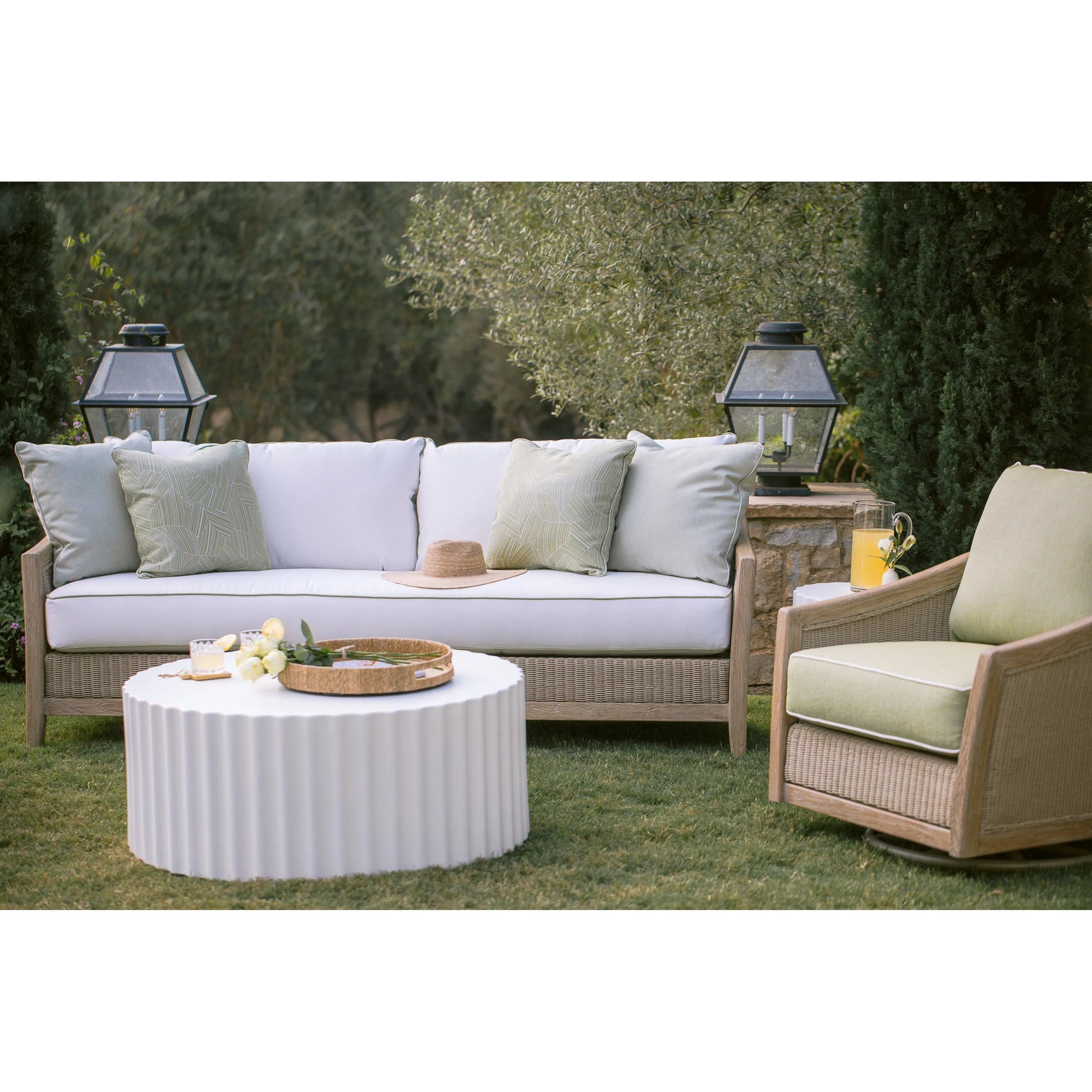 Cambria Outdoor Sofa by Sunset West in light wood. Made from teak in a rustic style.