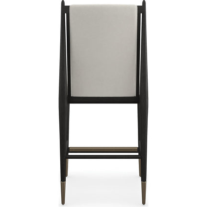 Unity Light Counter Stool by Caracole. Made from oak in a unique style.