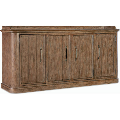 Americana Four-Door Buffet by Hooker Furniture in brown and honey finish. Made from oak veneers with solid-wood edge top in a rustic style.