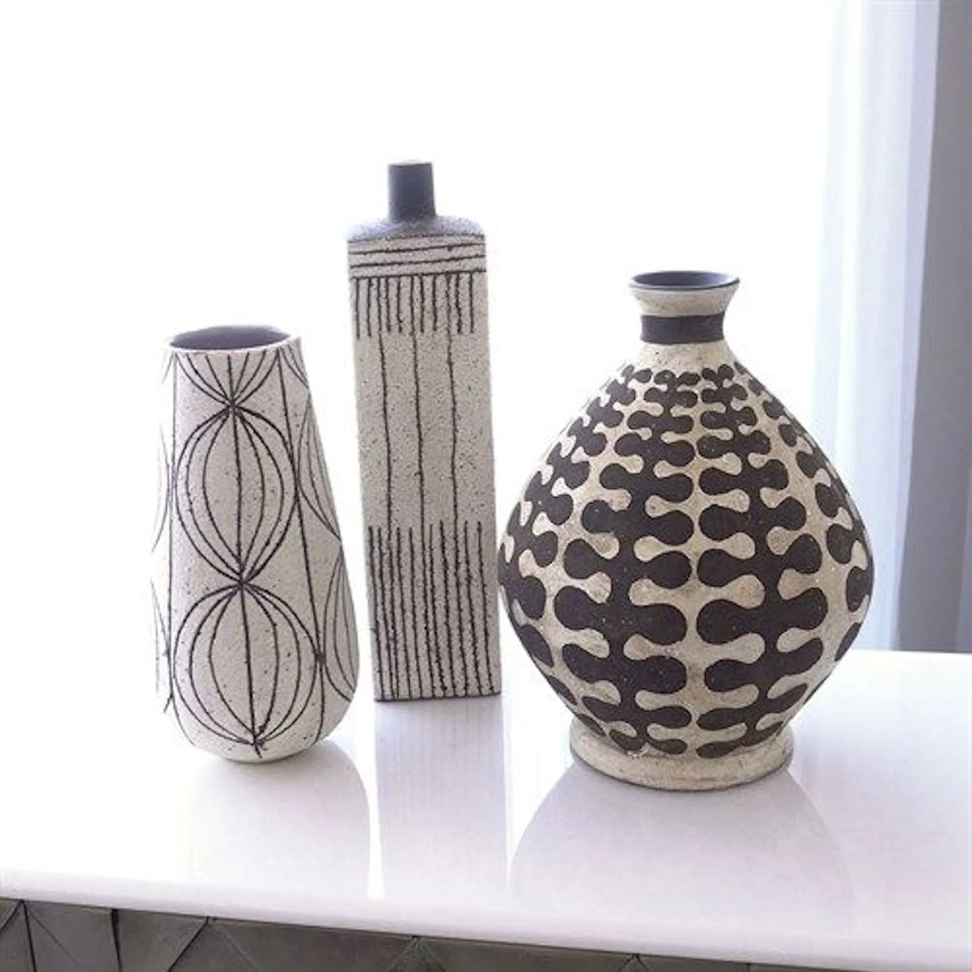 Graffiti Square Vase by Global Views. Made from earthenware in a eclectic & global style.