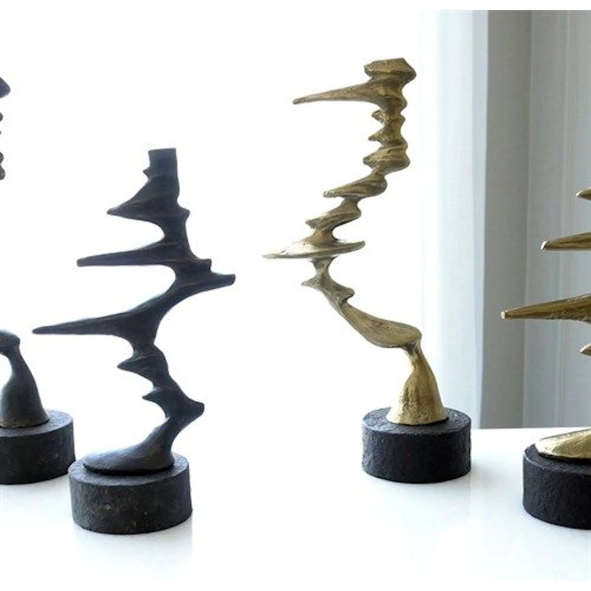 Wind Blown Sculpture by Global Views. Made from cast iron, granite in a eclectic & global style.