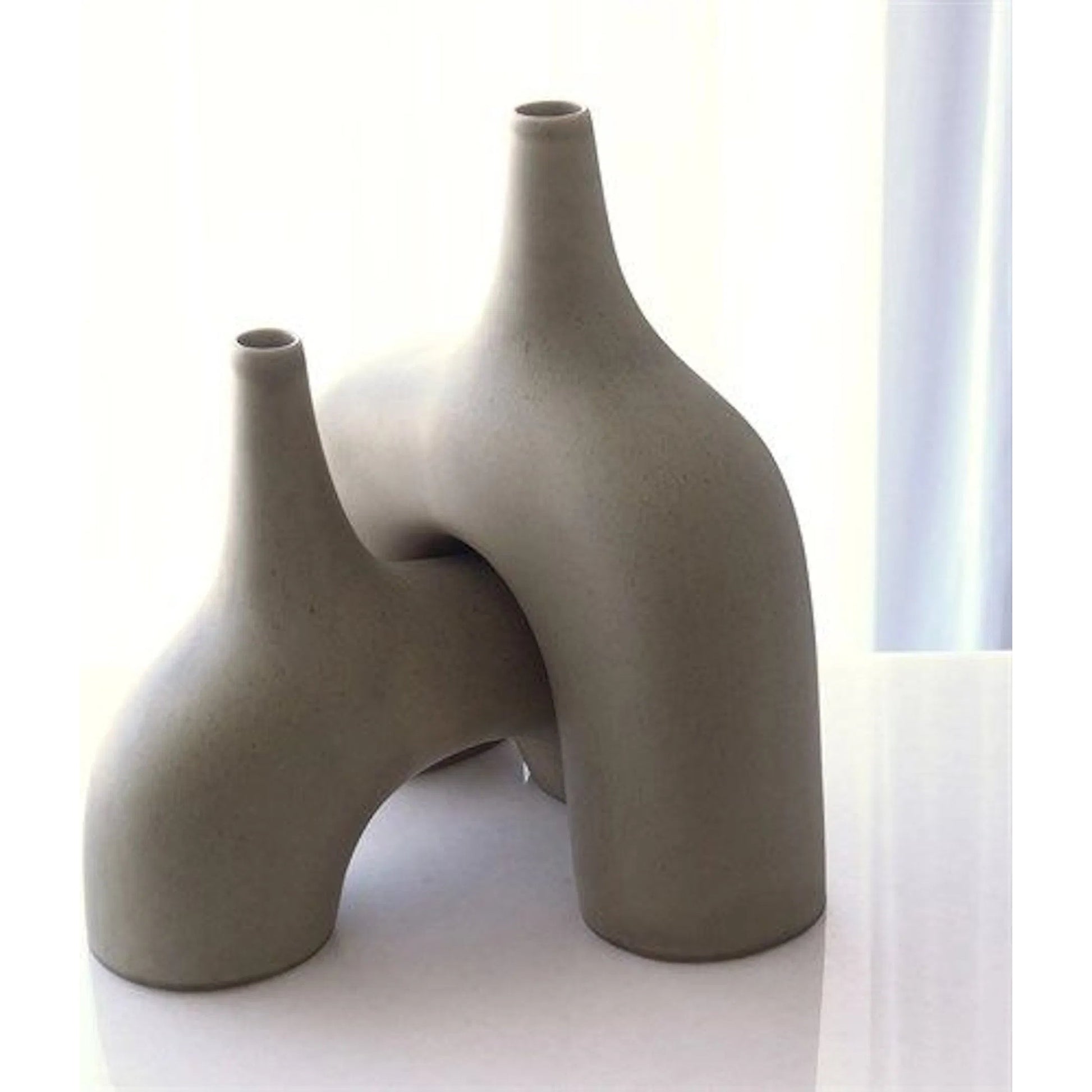 Stretch Vase by Global Views. Made from earthenware in a eclectic & global style.