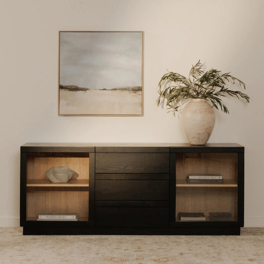 Charlotte Sideboard by Moe's Home Collection in black ash, natural ash, oak. Made from solid ash door frame, drawer handle, ash veneer over mdf body, oak veneer shelf, inner drawer, rubber wood base, 5mm tempered glass in a uni
