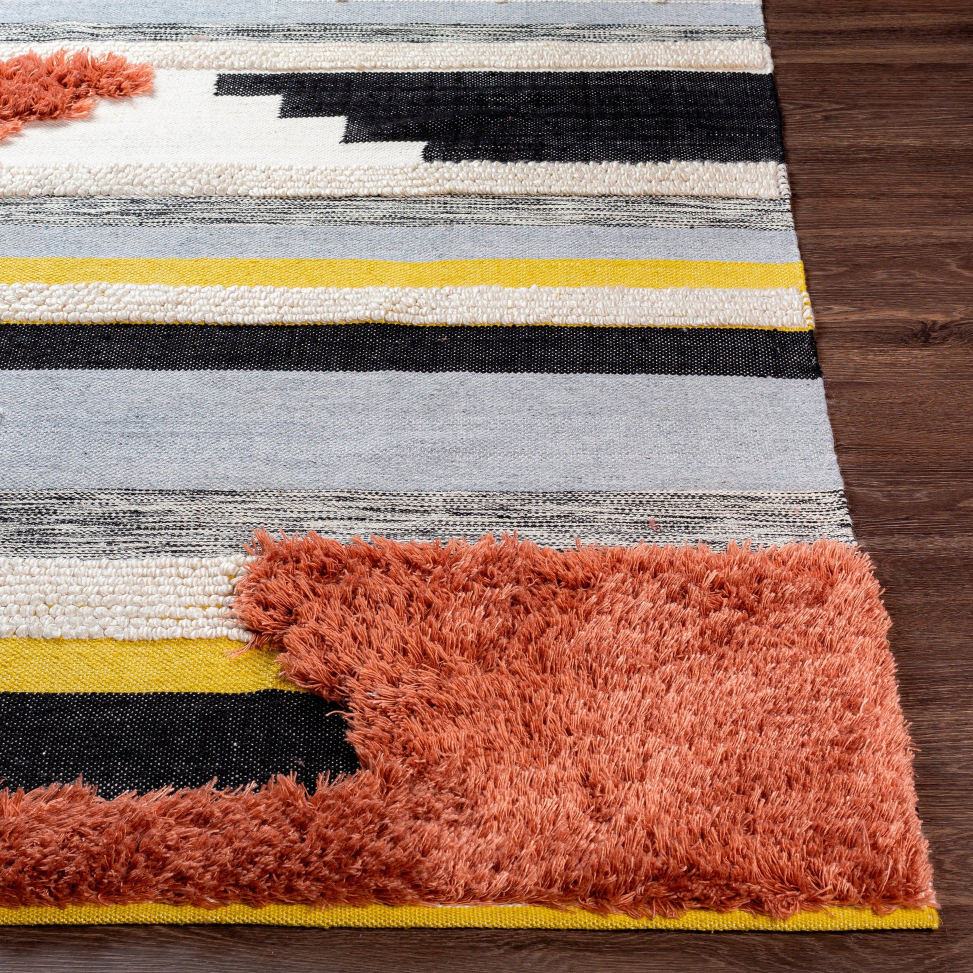Yuva YUV-2300 Indoor/Outdoor Rug by Surya in rust, mustard, black, medium gray, cream. Made from 100% recycled pet yarn in a unique style.