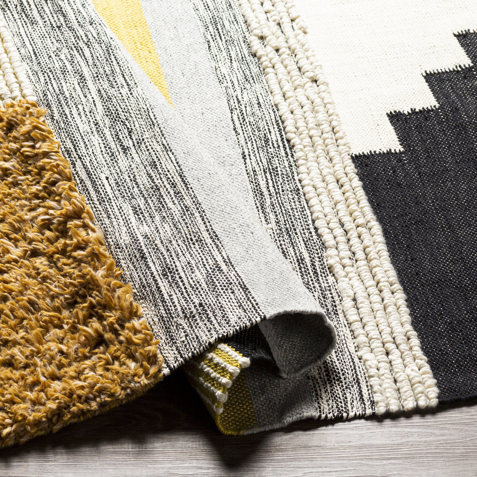 Yuva YUV-2300 Indoor/Outdoor Rug by Surya in rust, mustard, black, medium gray, cream. Made from 100% recycled pet yarn in a unique style.