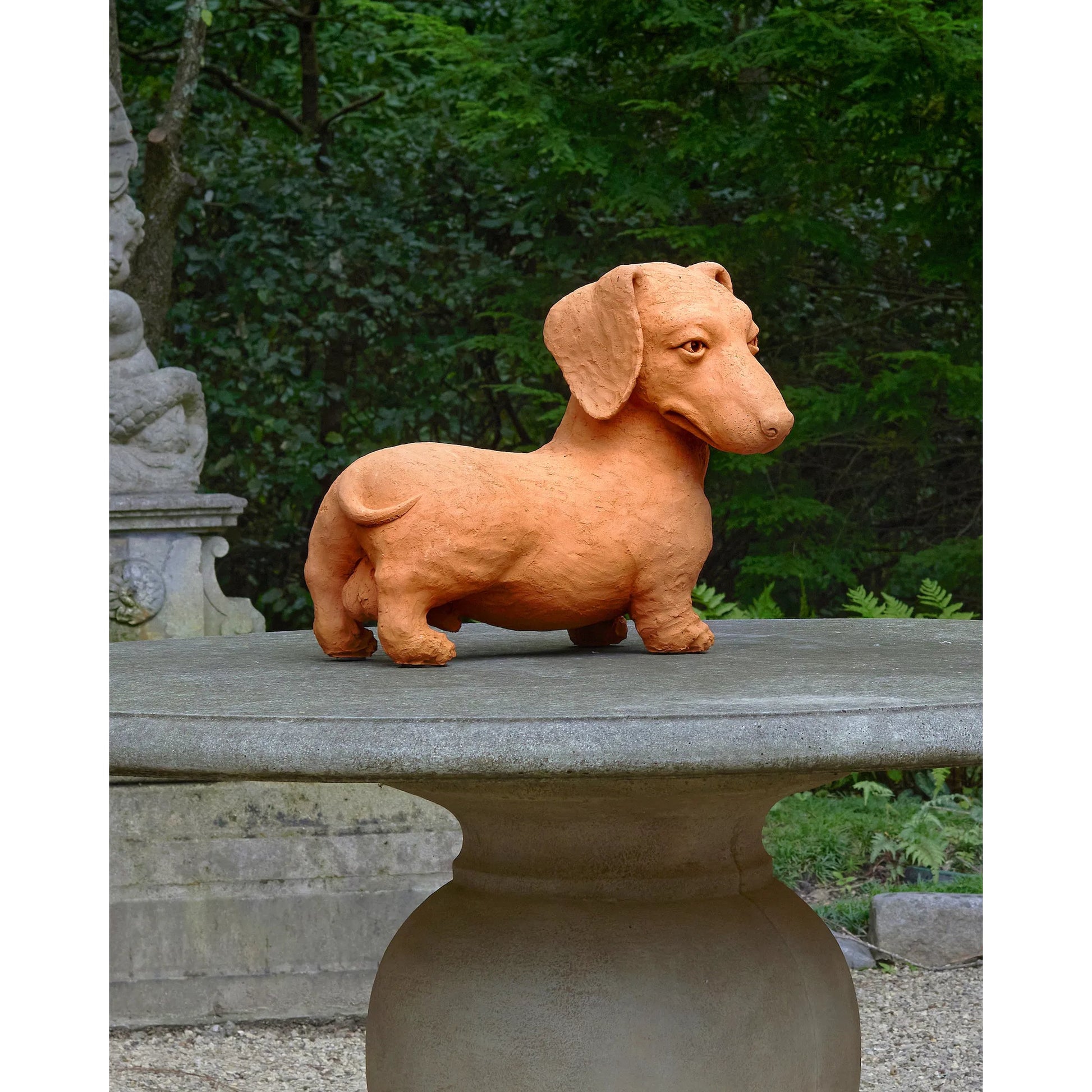 Rocky the Teckel by Currey and Company in natural. Made from terracotta in a cottage & farmhouse style.