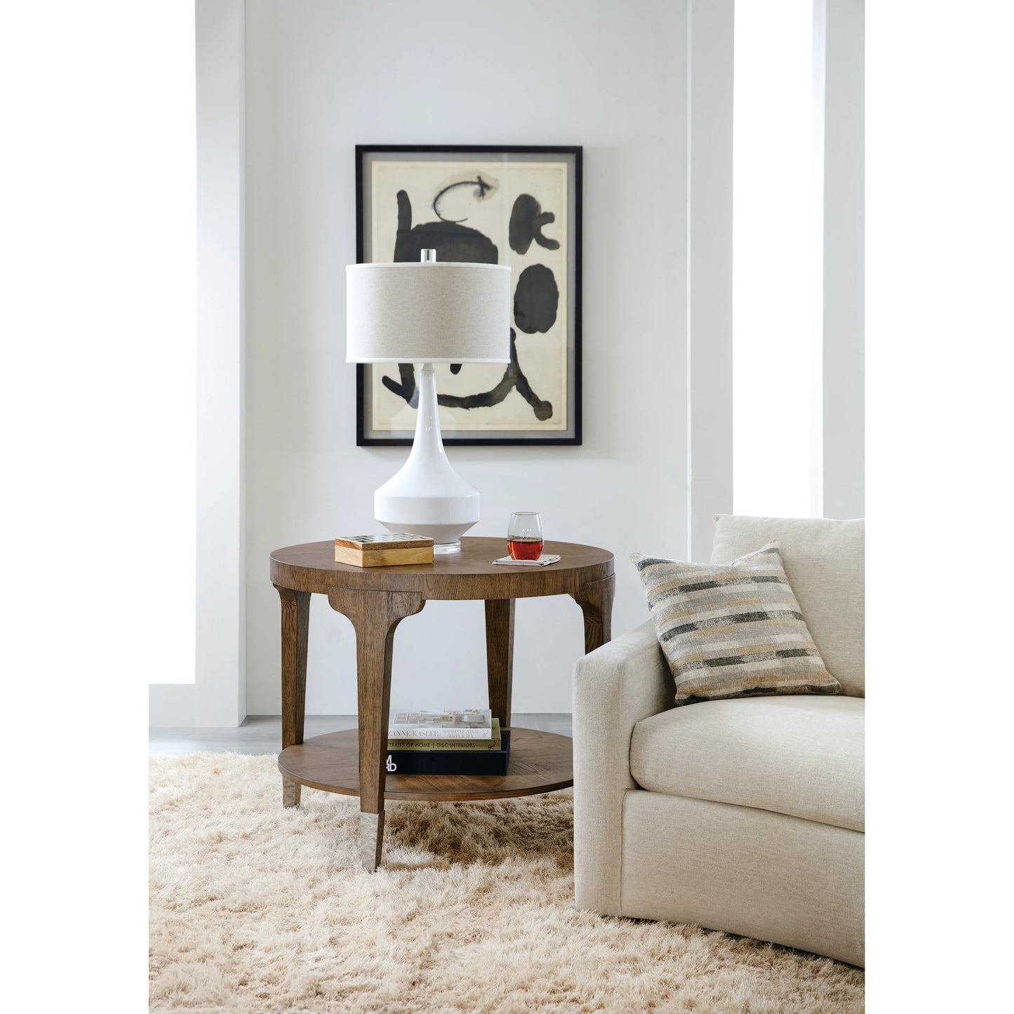 003 SI-1959574 | Lifestyle | Chapman Round Side Table by Hooker Furniture in sorrel. Made from white oak veneers, metal ferrules in a transitional style.