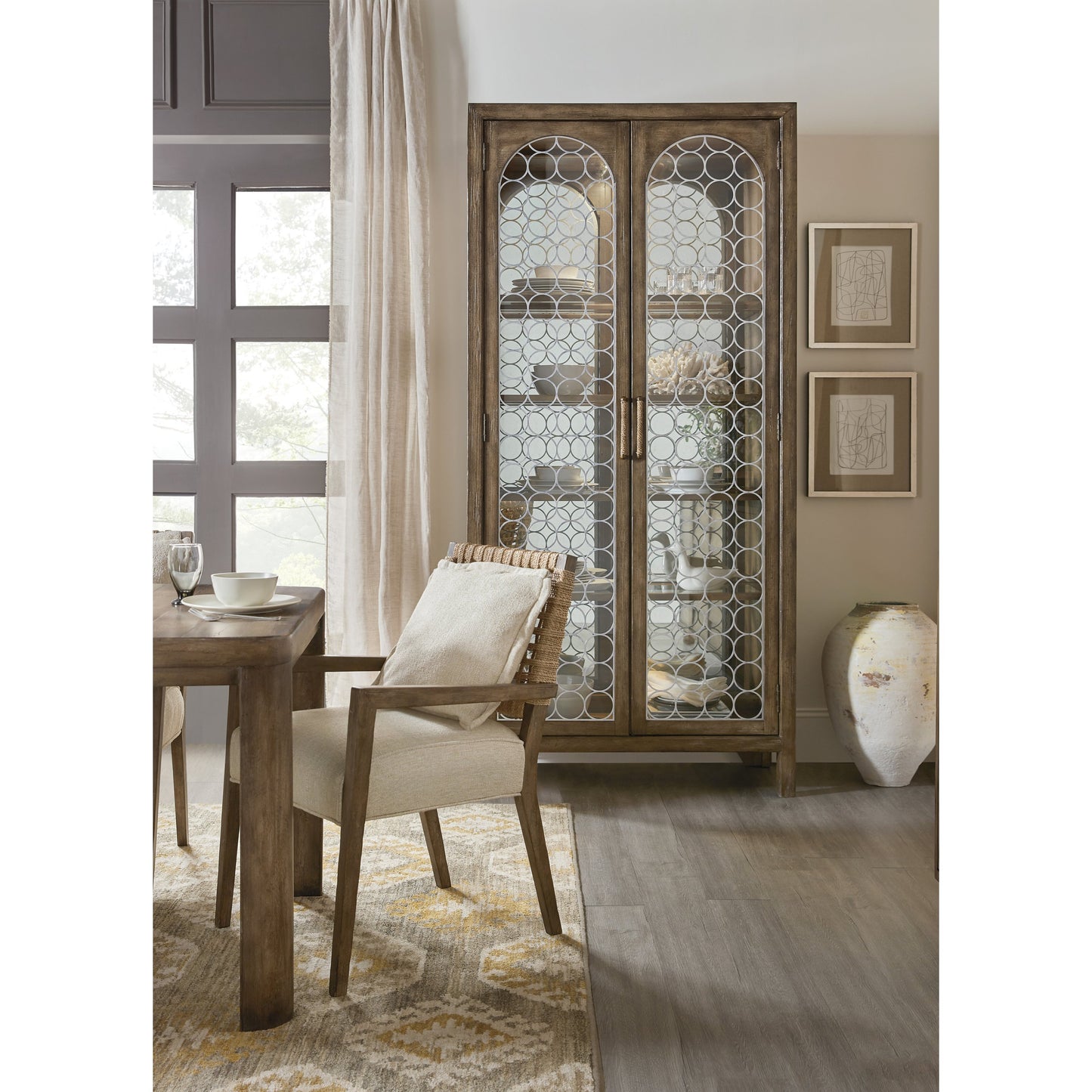 004 SI-1749797 | Lifestyle | Sundance Display Cabinet by Hooker Furniture in cliffside. Made from pecan veneers, puck light, metal, tempered glass, rope in a traditional style.