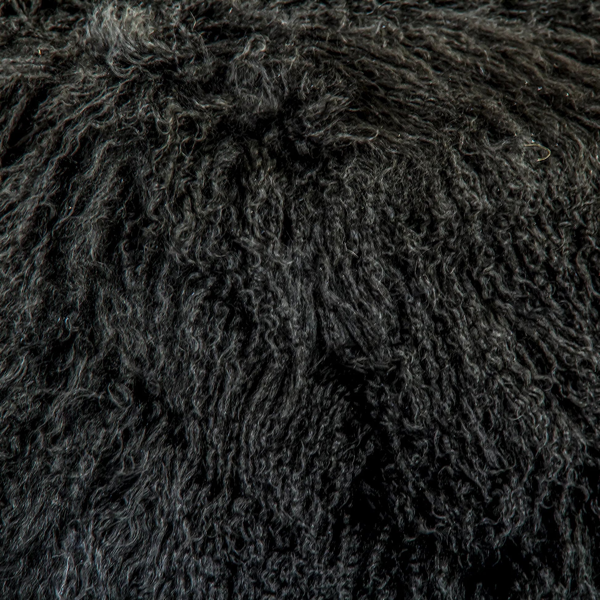 Tibetan Black Lamb Fur Pouf by Zentique. Made from lamb fur, polybeans in a unique style.