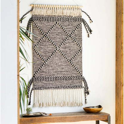 Zanafi Tassels Indoor/Outdoor Wall Hanging by Surya in beige, black. Made from 100% cotton, 100% wood in a eclectic & global style.