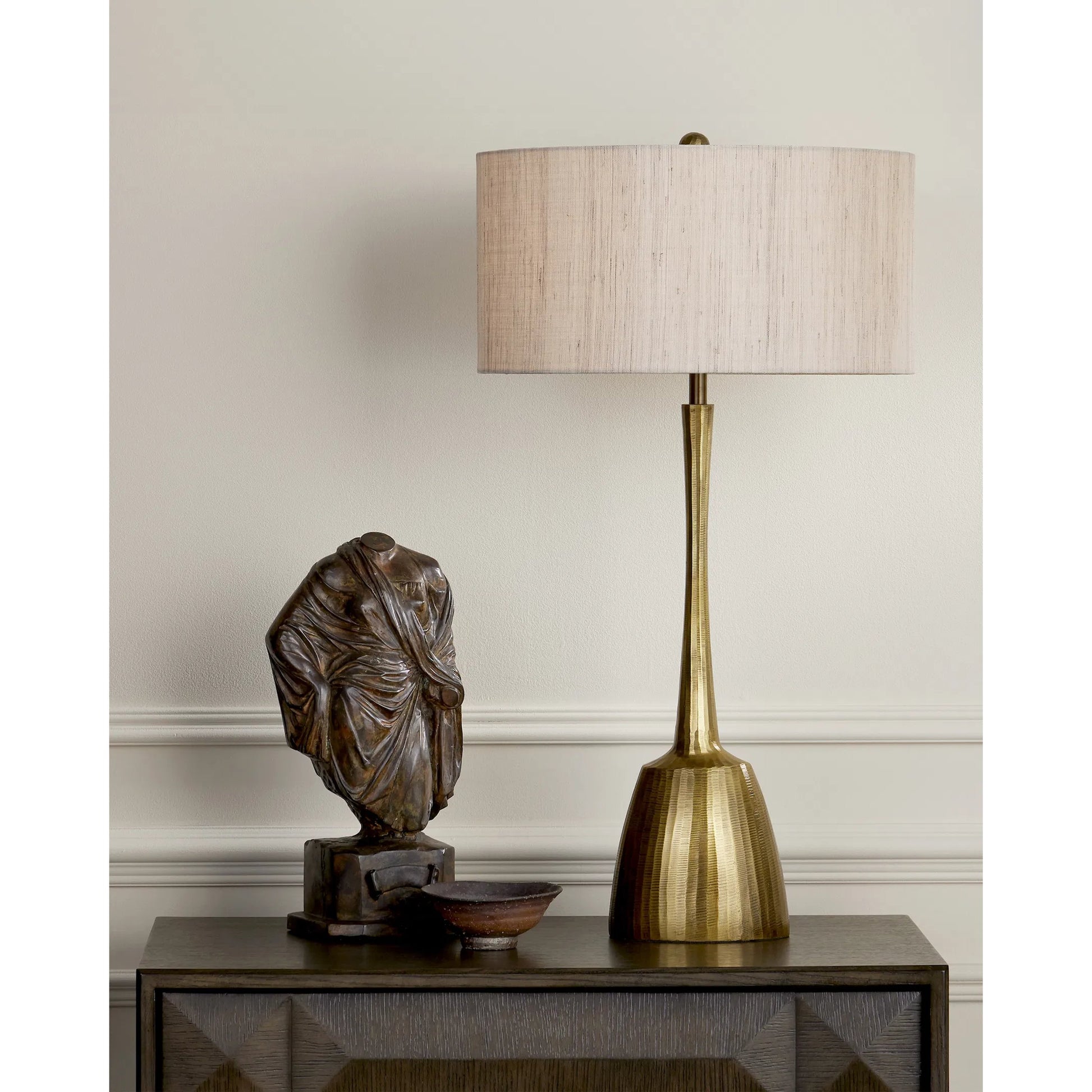 Cheenee Table Lamp by Currey and Company in antique brass. Made from cast aluminum in a modern style.
