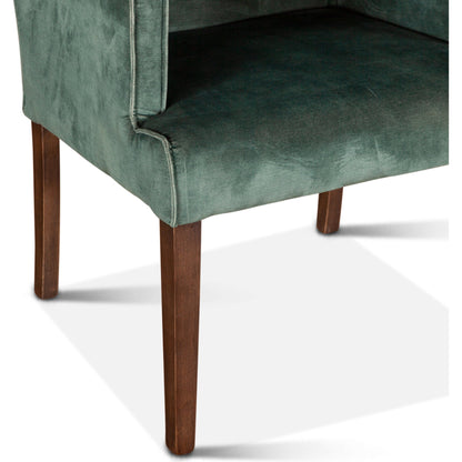Avery Armchair by World Interiors in dark green and brown. Made from wood, velvet in a modern style.