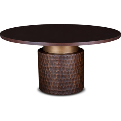 Vallarta Carved Wood Round Dining Table by World Interiors in bronze, gold and two toned bronze. Made from mango wood, cast aluminum in a eclectic & global style.