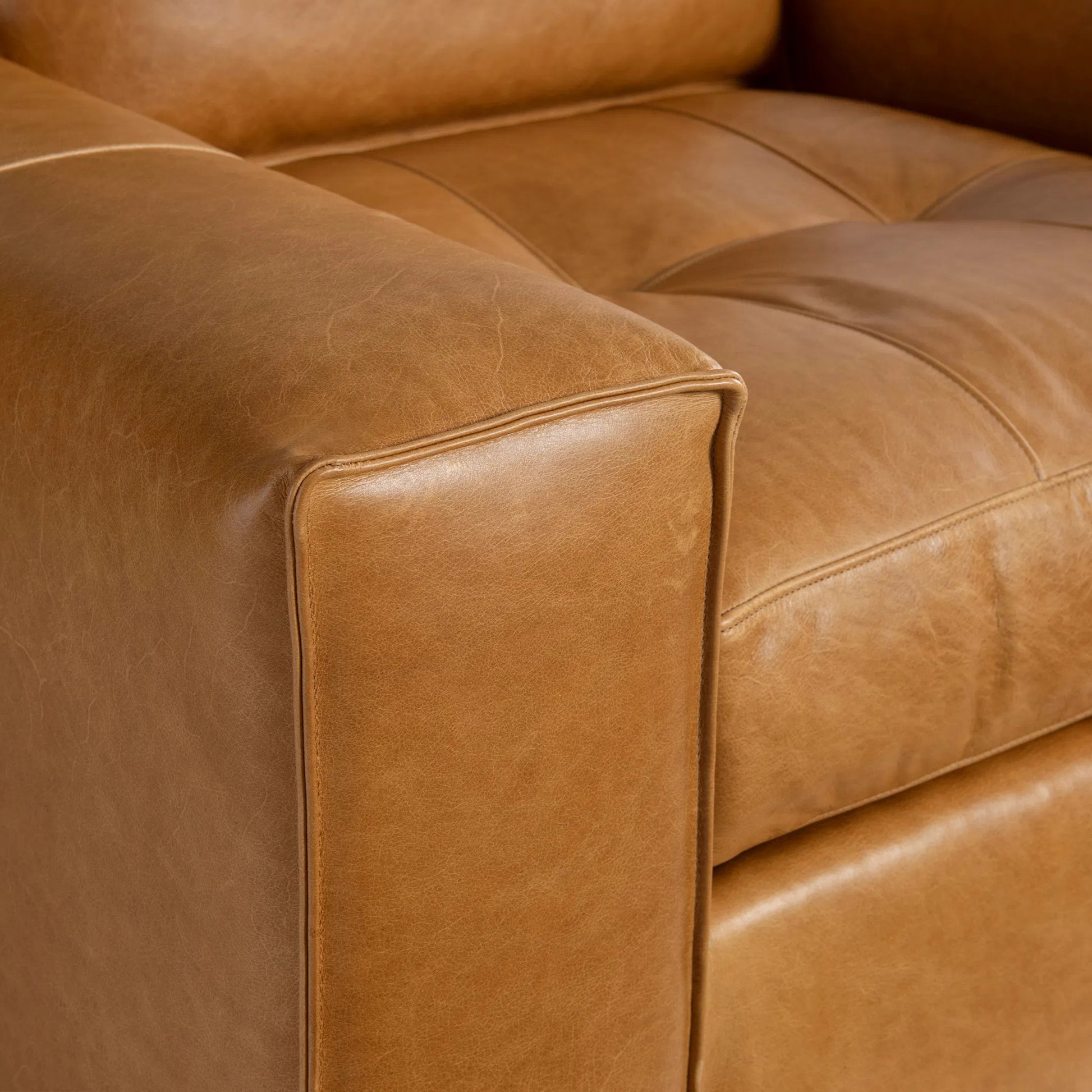 Nest Leather Swivel Chair by Bernhardt in tan. Made from leather, polyfoam core, polyester fibers, waterfowl feathers, waterfowl down in a traditional style.
